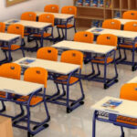 A Picture Representing The Modern Classroom Interior With Empty Classroom Benches, Desks And Chairs.